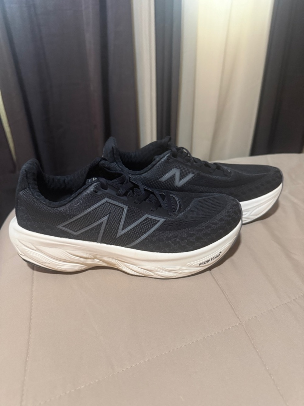New Balance  Black Athletic Shoes with White Midsole